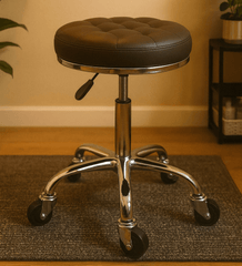 Brown leather stool with chrome base on a dark rug